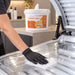 Antibacterial wipe bucket, white with orange label and 600 sheets; Liquidate® Sunbed & Salon wipes clean a clear sunbed surface.