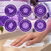 Liquidate® Sunbed & Salon biodegradable antibacterial wipes, white textured bamboo sheets with lemon-scented cleaning formula and purple feature icons