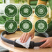Antibacterial wipes, Liquidate® Yoga & Pilates, white textured sheet with green packaging and biodegradable bamboo claims.